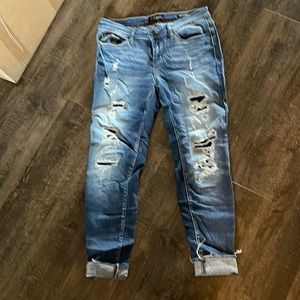 Size 11/30 distressed denim, skin doesn’t show patches behind the distressing JB